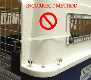 incorrect method of installing cable ties to kennel door
